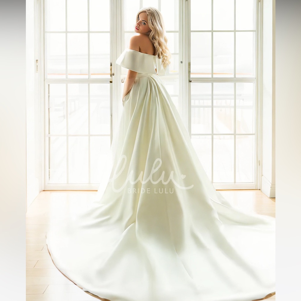 Wedding dress- never worn- tags still attached
